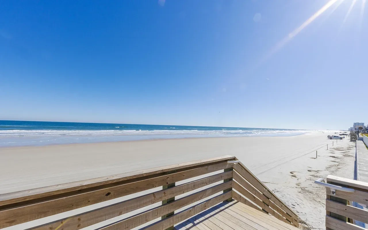 Beach boardwalk steps from the building