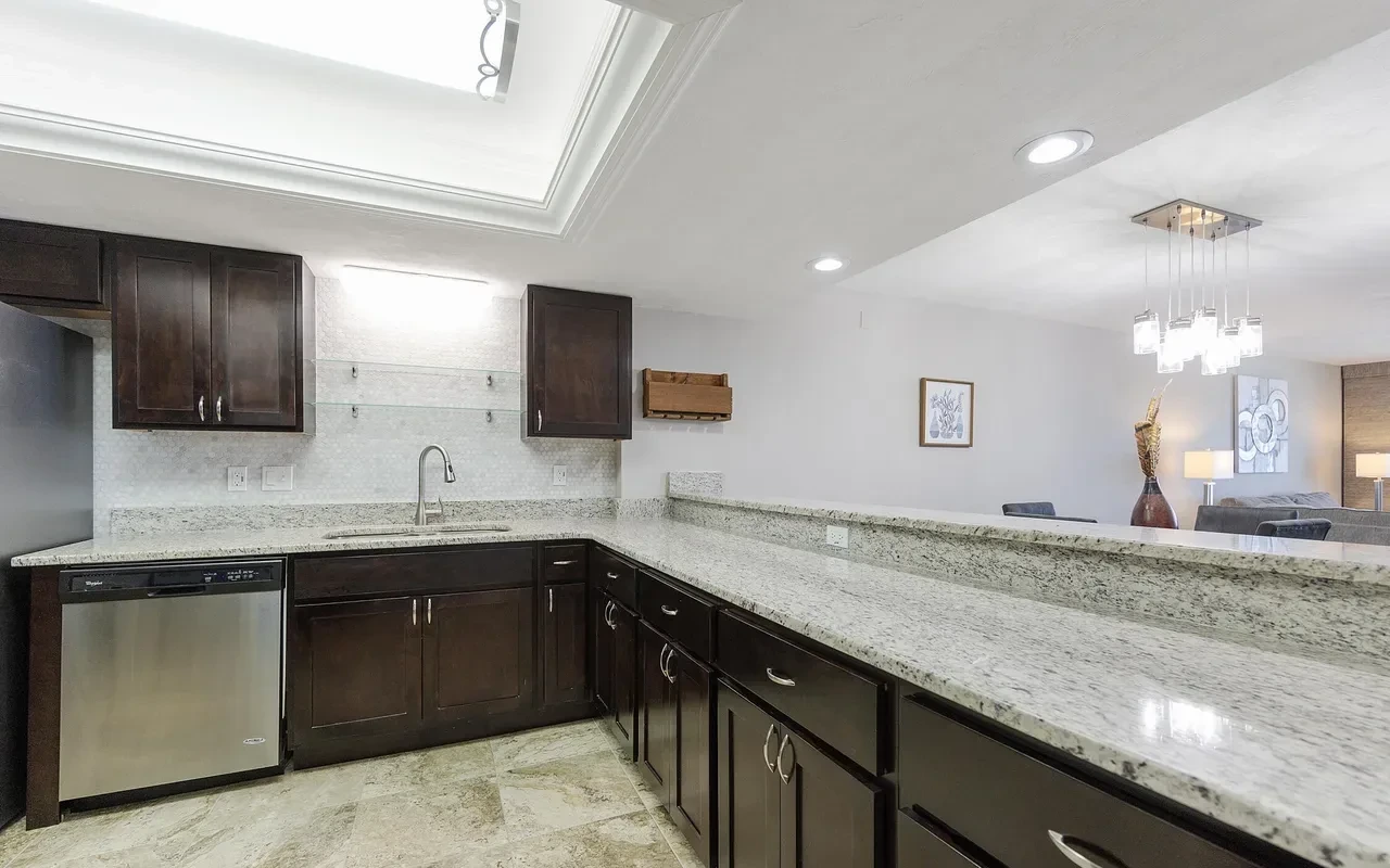 Kitchen with breakfast bar and granite counters