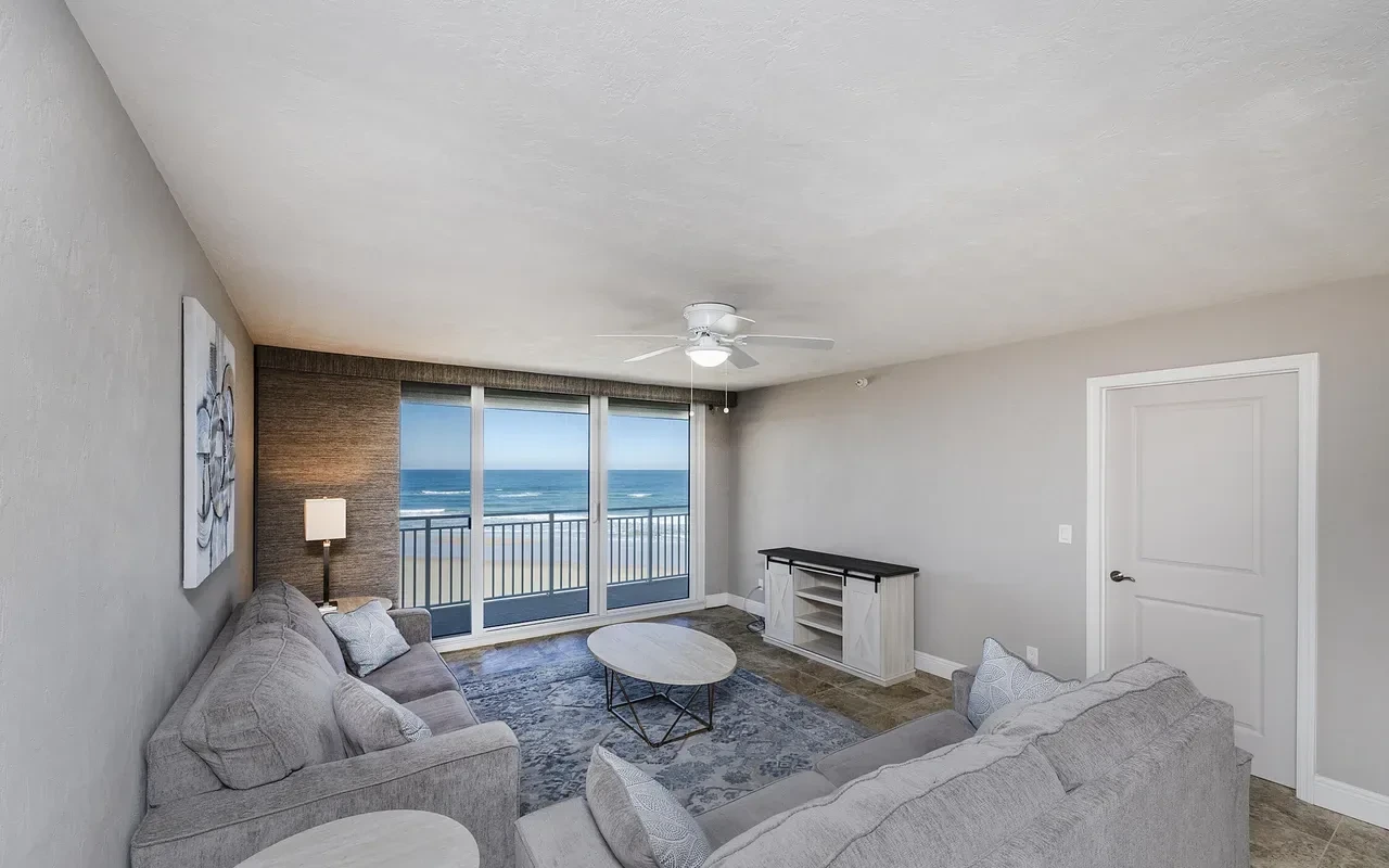 Living room with ocean view and balcony